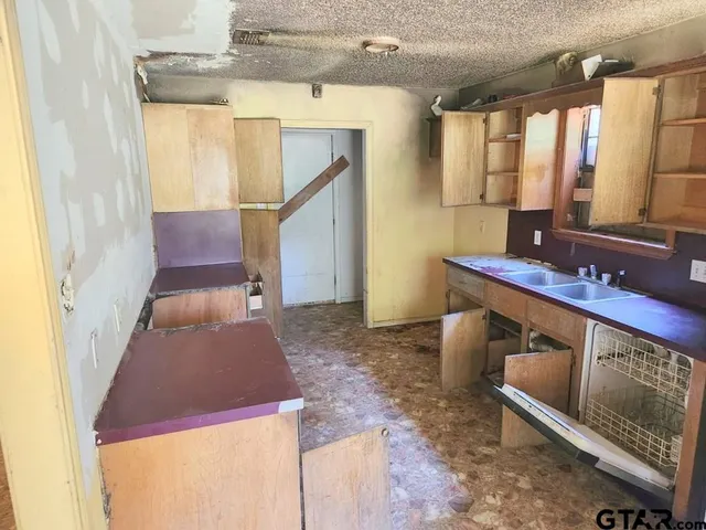 a view of living room with furniture and a fireplace