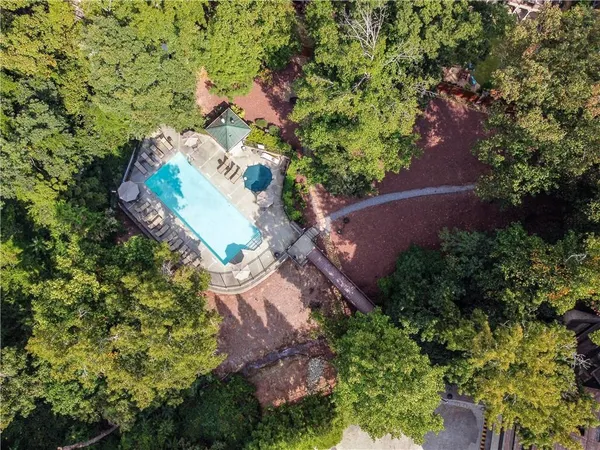 an aerial view of a house with a yard and garden