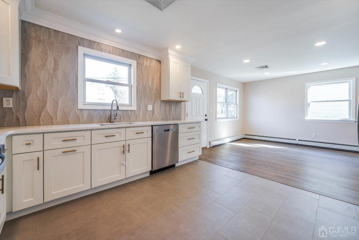 364 New Market Road Dunellen, NJ 08812 - Photo 20 of 36 a view of a kitchen with a sink cabinets and window