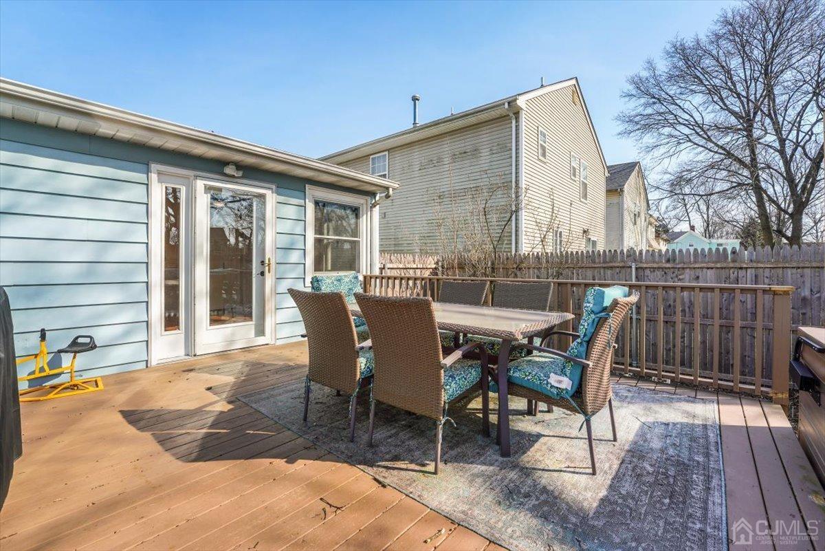 364 New Market Road Dunellen, NJ 08812 - Photo 31 of 36 a view of a roof deck with table and chairs and wooden floor
