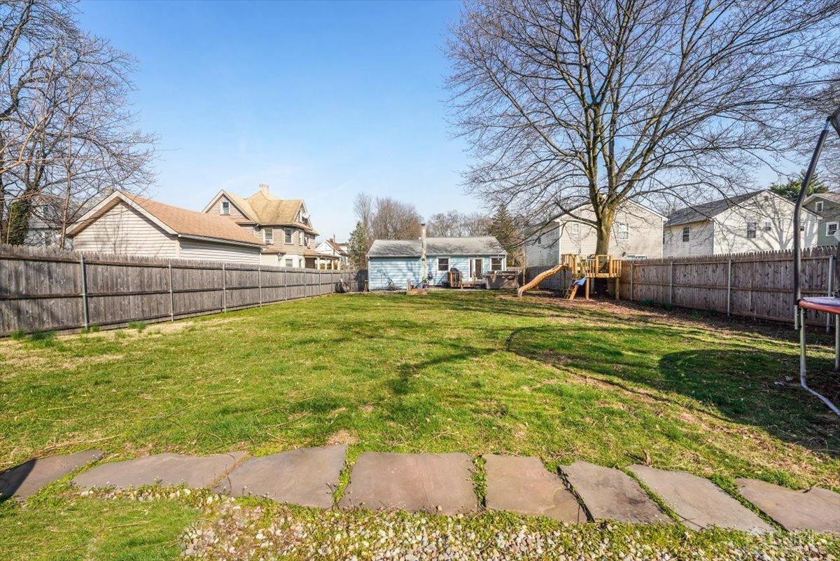 364 New Market Road Dunellen, NJ 08812 - Photo 34 of 36 a view of a backyard with a large tree