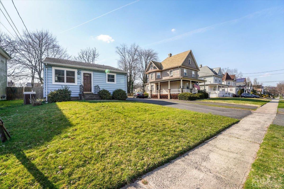 364 New Market Road Dunellen, NJ 08812 - Photo 36 of 36 a front view of a house with a yard