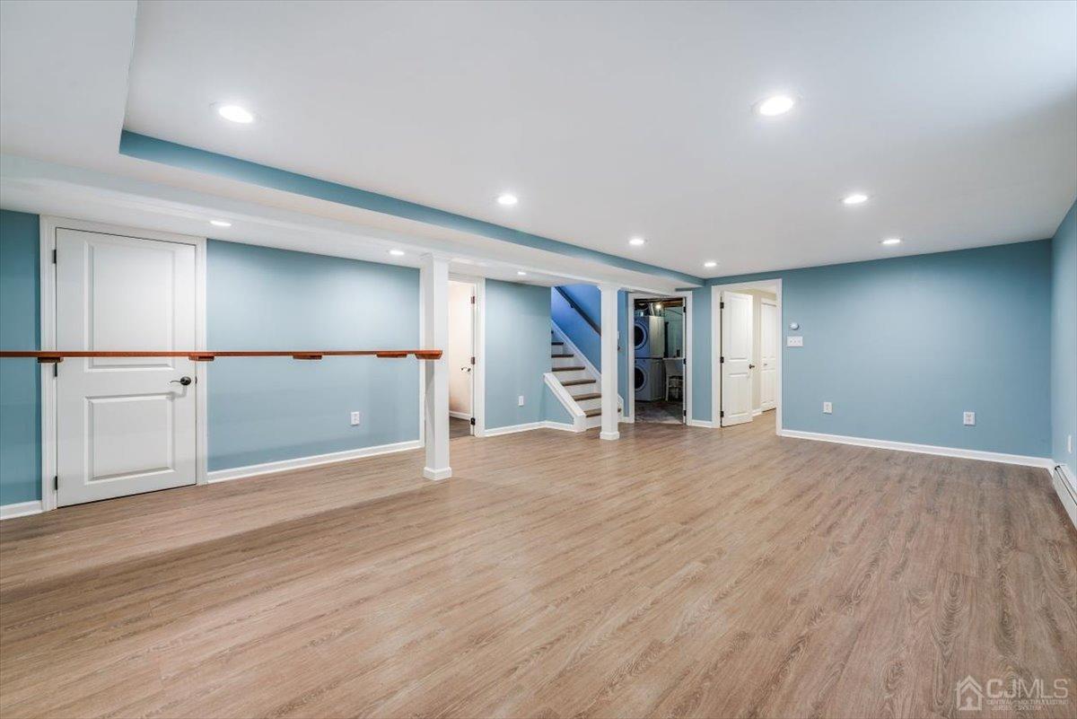 364 New Market Road Dunellen, NJ 08812 - Photo 5 of 36 a view of an empty room with wooden floor