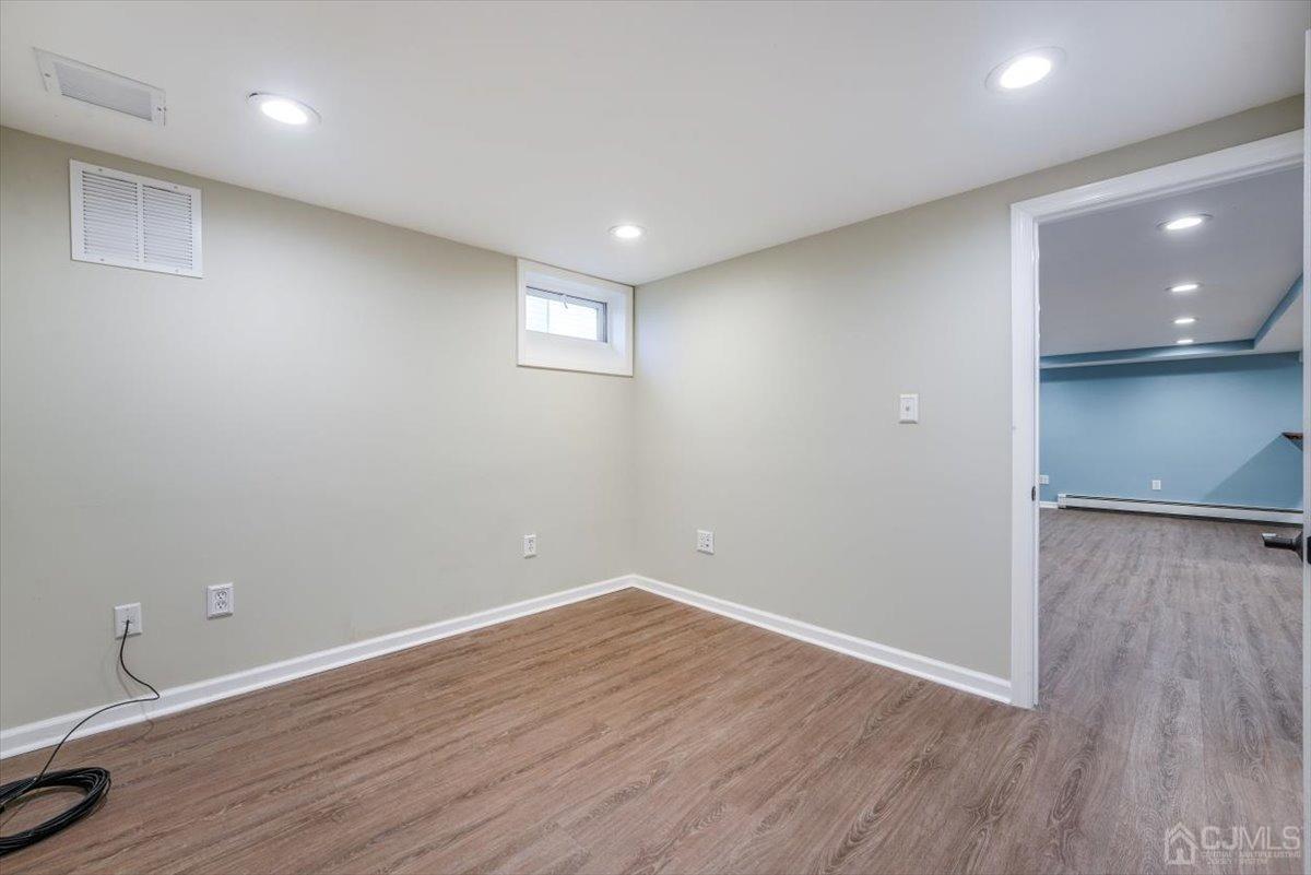 364 New Market Road Dunellen, NJ 08812 - Photo 8 of 36 a view of empty room with wooden floor