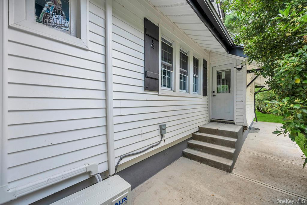 15 Superior Road Bellerose Village, NY 11001 - Photo 26 of 29 View of side of home featuring an ac unit and entry steps