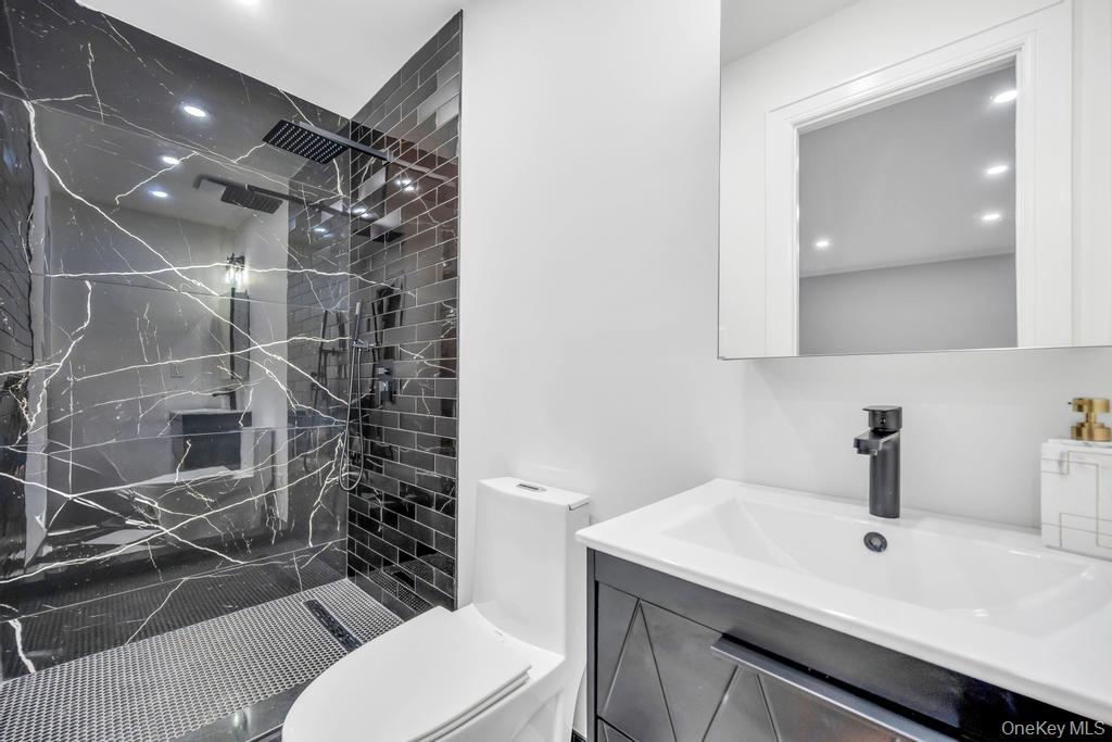 15 Superior Road Bellerose Village, NY 11001 - Photo 9 of 29 connected to the great sized 1st floor bedroom includes a Full bath, a marble finish shower, and recessed lightingRadiant heated floors