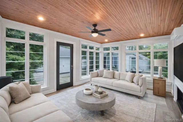a view of a living room and bathroom