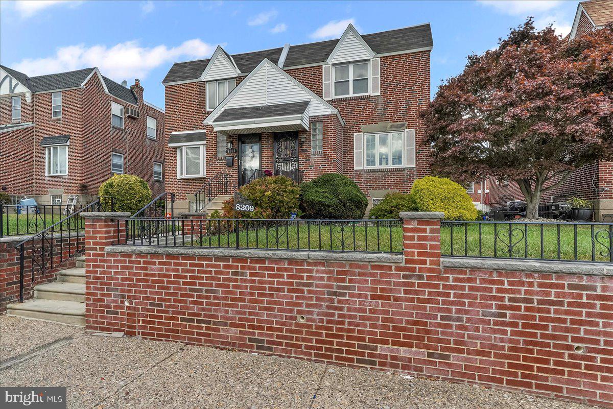8309 Lynnewood Road Philadelphia, PA 19150 - Photo 1 of 28 a brick building with a yard