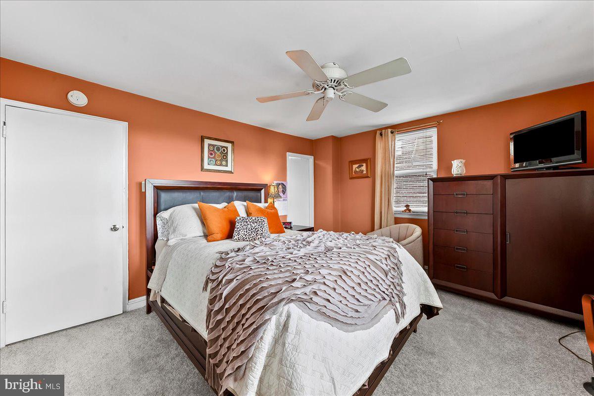 8309 Lynnewood Road Philadelphia, PA 19150 - Photo 13 of 28 a bedroom with a bed and a flat tv screen