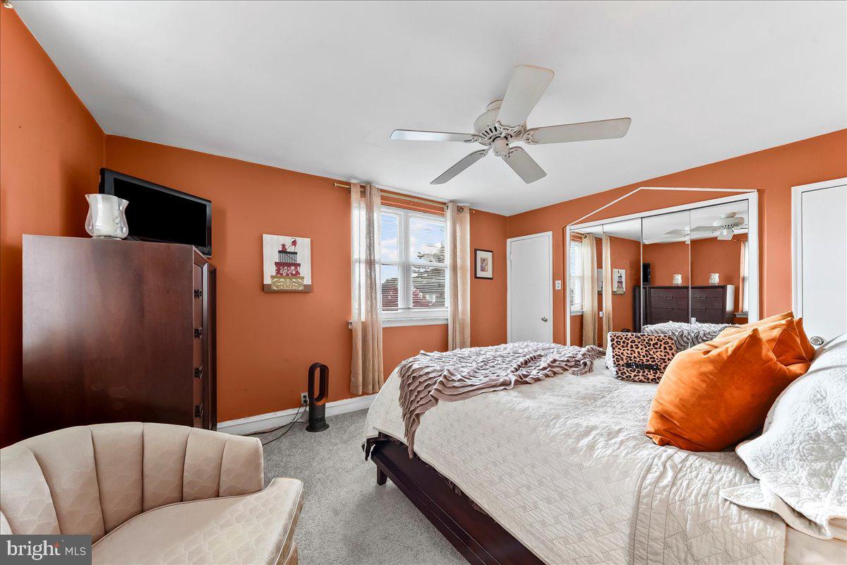 8309 Lynnewood Road Philadelphia, PA 19150 - Photo 14 of 28 a bedroom with a bed couch and window