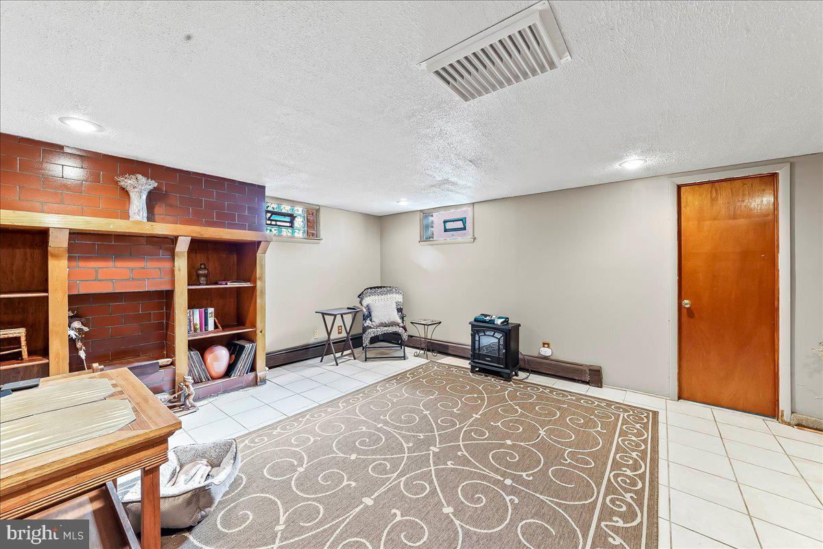 8309 Lynnewood Road Philadelphia, PA 19150 - Photo 22 of 28 a bedroom with furniture and a window