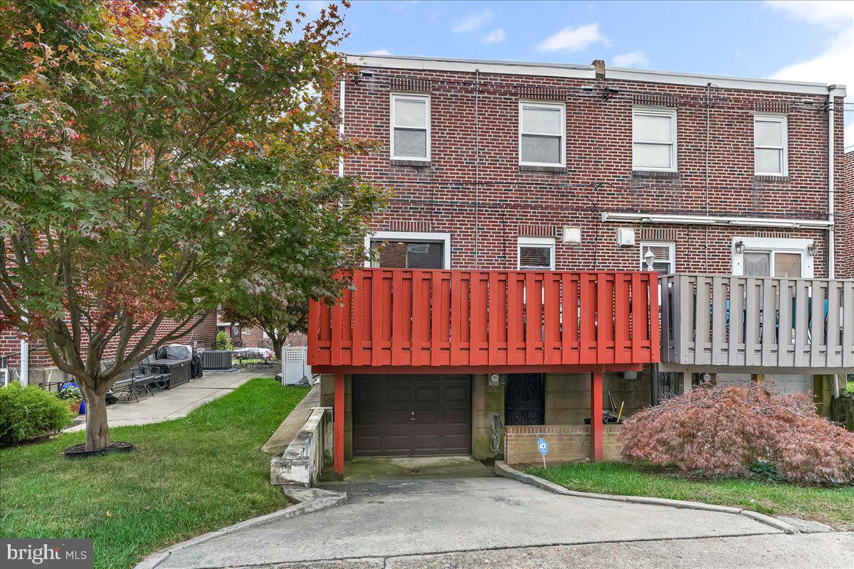 8309 Lynnewood Road Philadelphia, PA 19150 - Photo 27 of 28 a front view of a house with a garden and plants