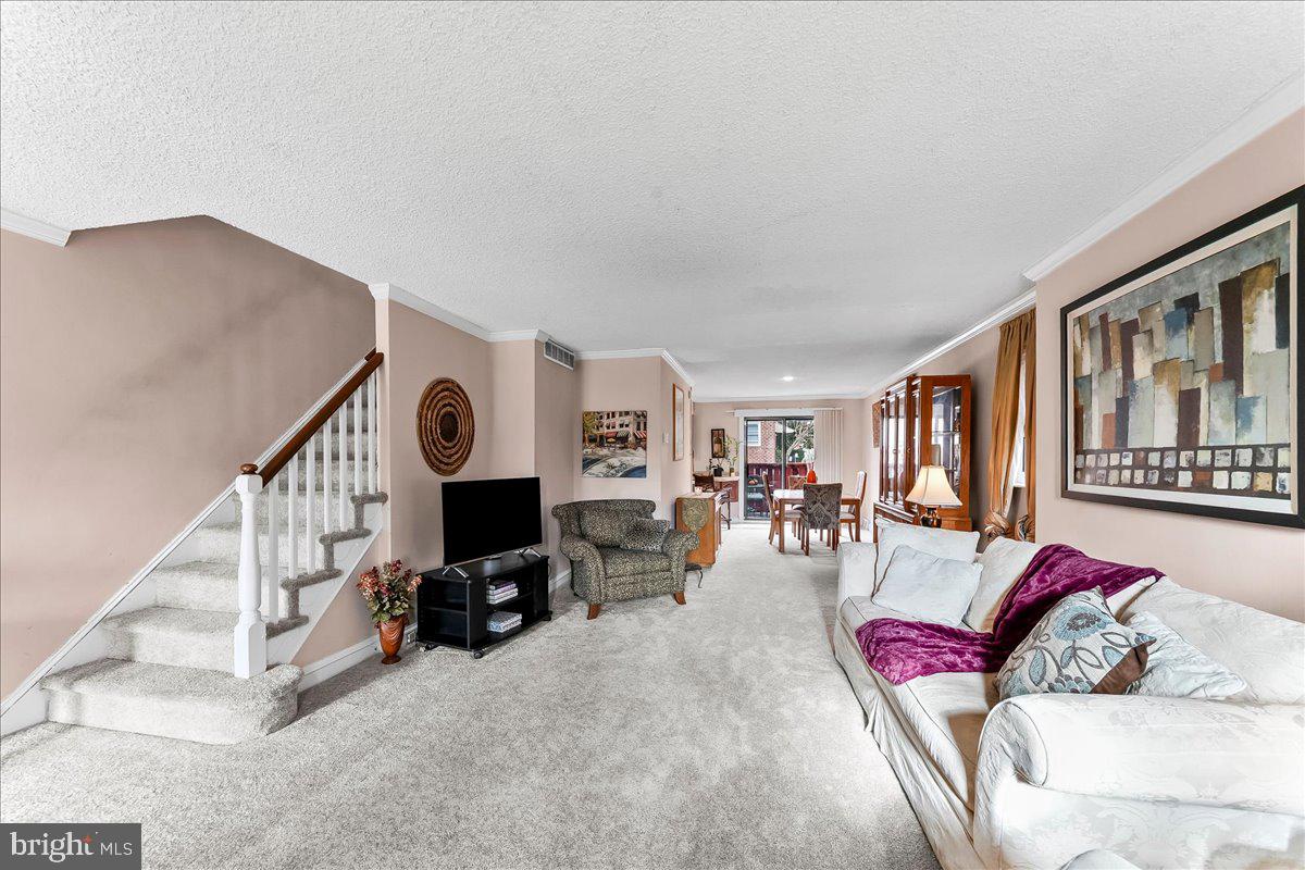 8309 Lynnewood Road Philadelphia, PA 19150 - Photo 4 of 28 a living room with furniture and a flat screen tv