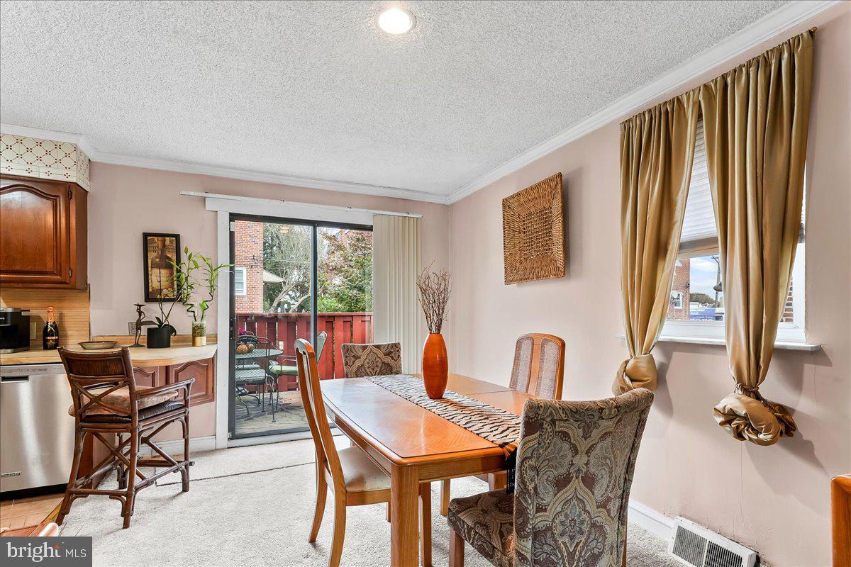 8309 Lynnewood Road Philadelphia, PA 19150 - Photo 5 of 28 a living room with furniture fireplace and a flat screen tv