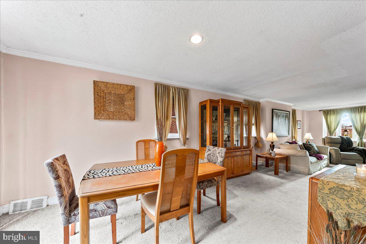 8309 Lynnewood Road Philadelphia, PA 19150 - Photo 6 of 28 a dining room with furniture and wooden floor