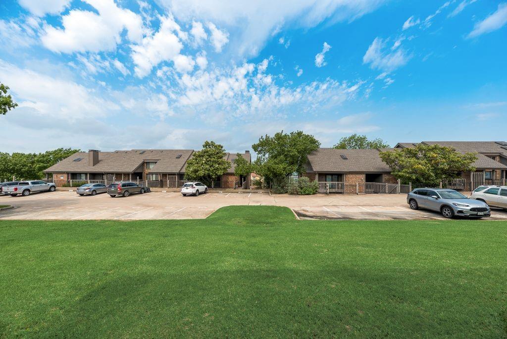 813 Signal Ridge Place, Unit 813 Rockwall, TX 75032 - Photo 18 of 22 LARGE GRASS AREA BEHIND CONDO AND ADDTIONAL PARKING