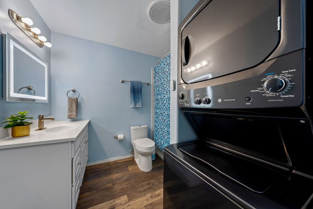 3411 Wilcox Road, Unit BV25 Lihue, HI 96766 - Photo 11 of 21 a bathroom with a sink a toilet and mirror