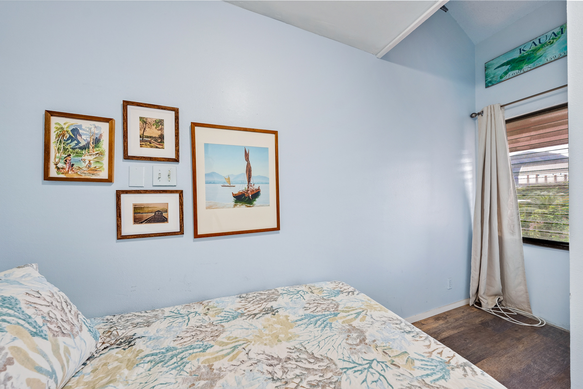 3411 Wilcox Road, Unit BV25 Lihue, HI 96766 - Photo 12 of 21 a bedroom with a bed and a window