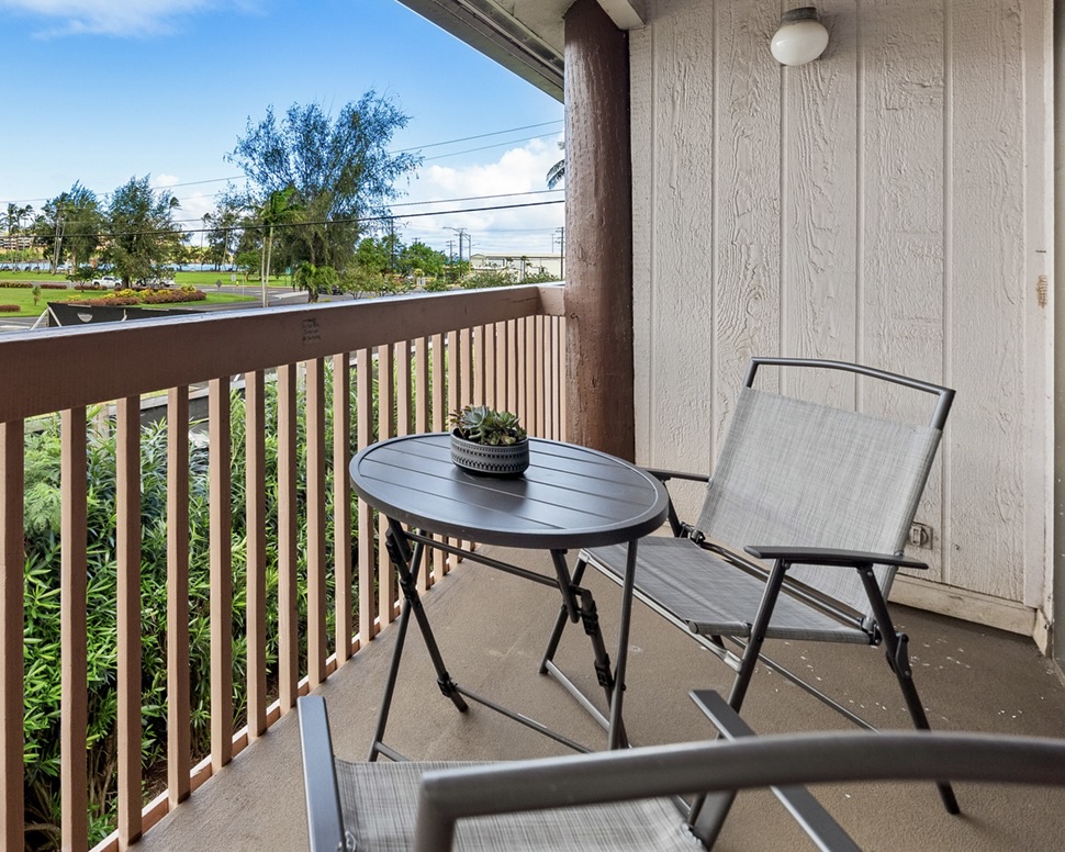 3411 Wilcox Road, Unit BV25 Lihue, HI 96766 - Photo 6 of 21 a view of a balcony with table and chairs