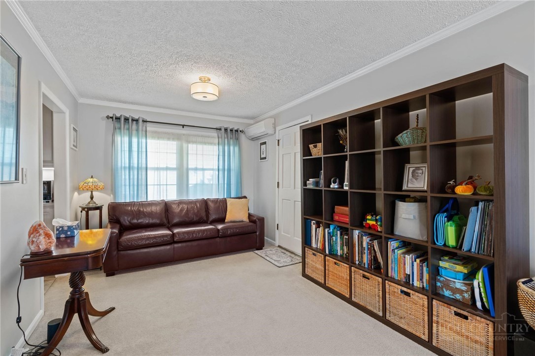 112 Chandy Street Boone, NC 28607 - Photo 12 of 50 a living room with furniture and a book shelf