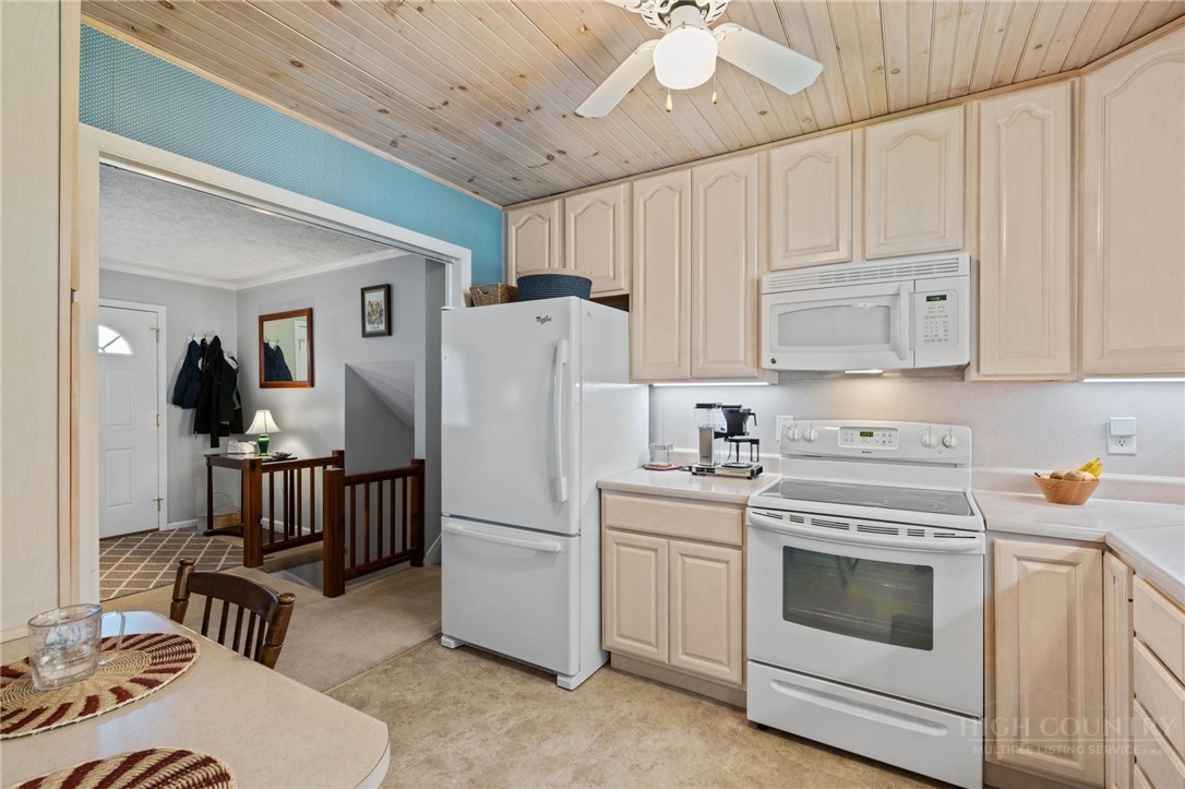 112 Chandy Street Boone, NC 28607 - Photo 13 of 50 a kitchen with a white cabinets and white appliances