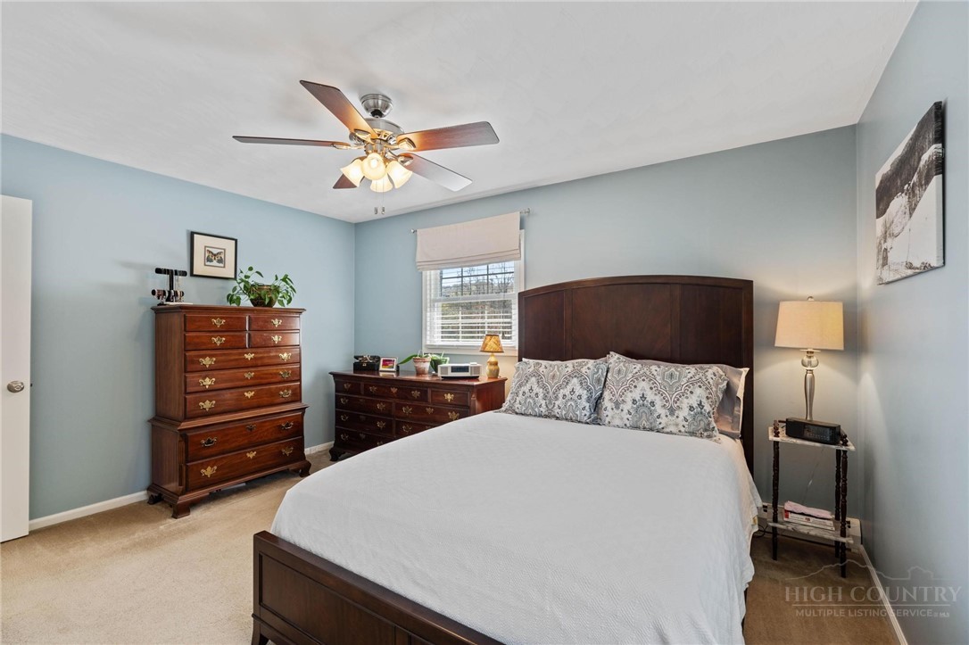 112 Chandy Street Boone, NC 28607 - Photo 19 of 50 a bedroom with a bed and a cabinets