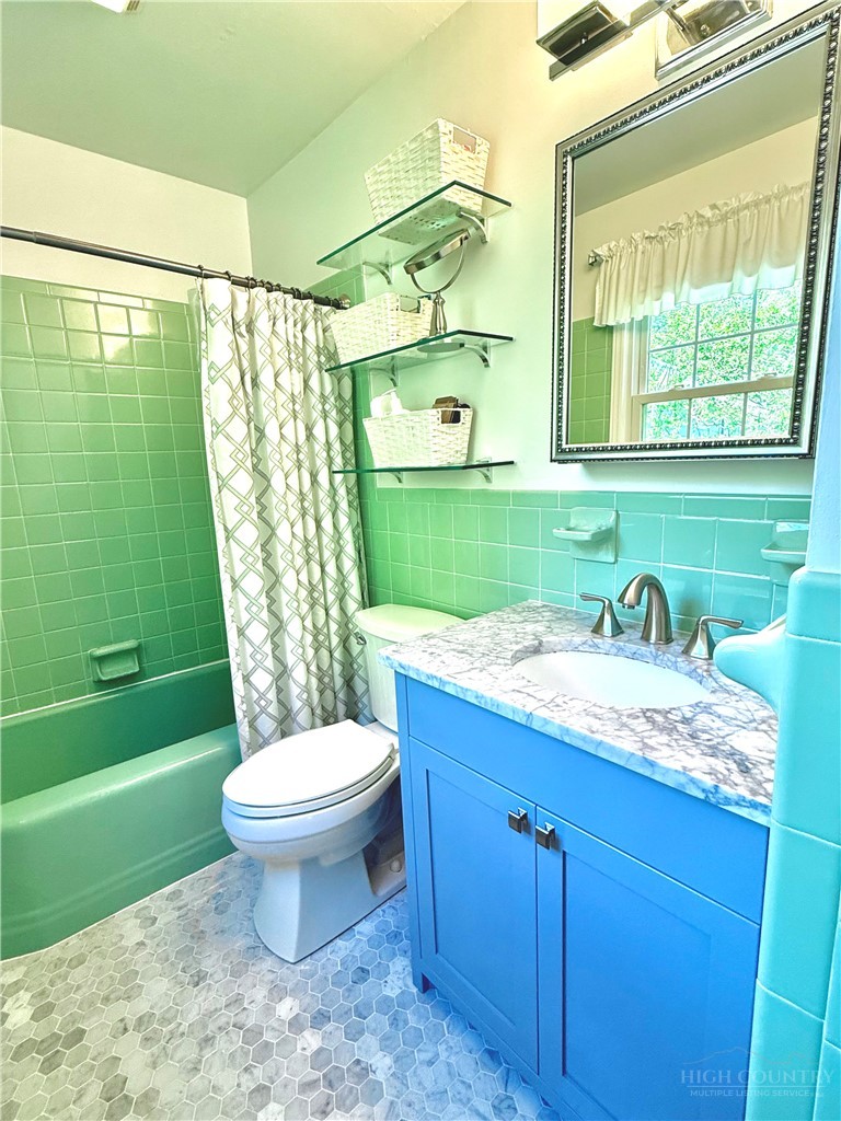 112 Chandy Street Boone, NC 28607 - Photo 20 of 50 a bathroom with a granite countertop toilet sink and mirror