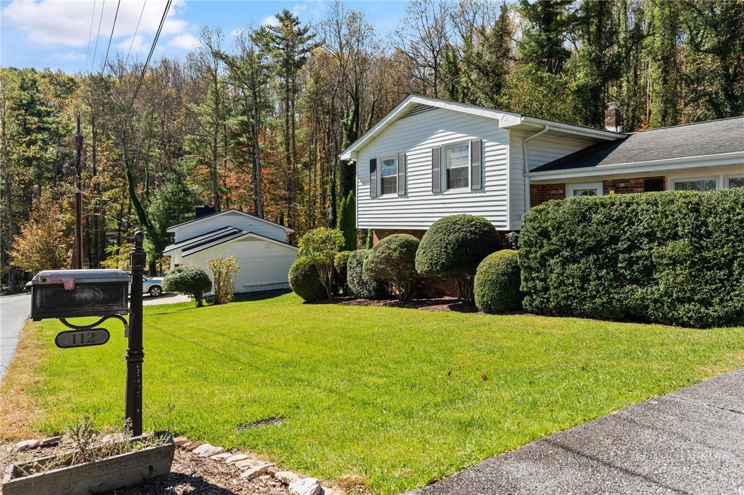 112 Chandy Street Boone, NC 28607 - Photo 2 of 50 a front view of a house with garden