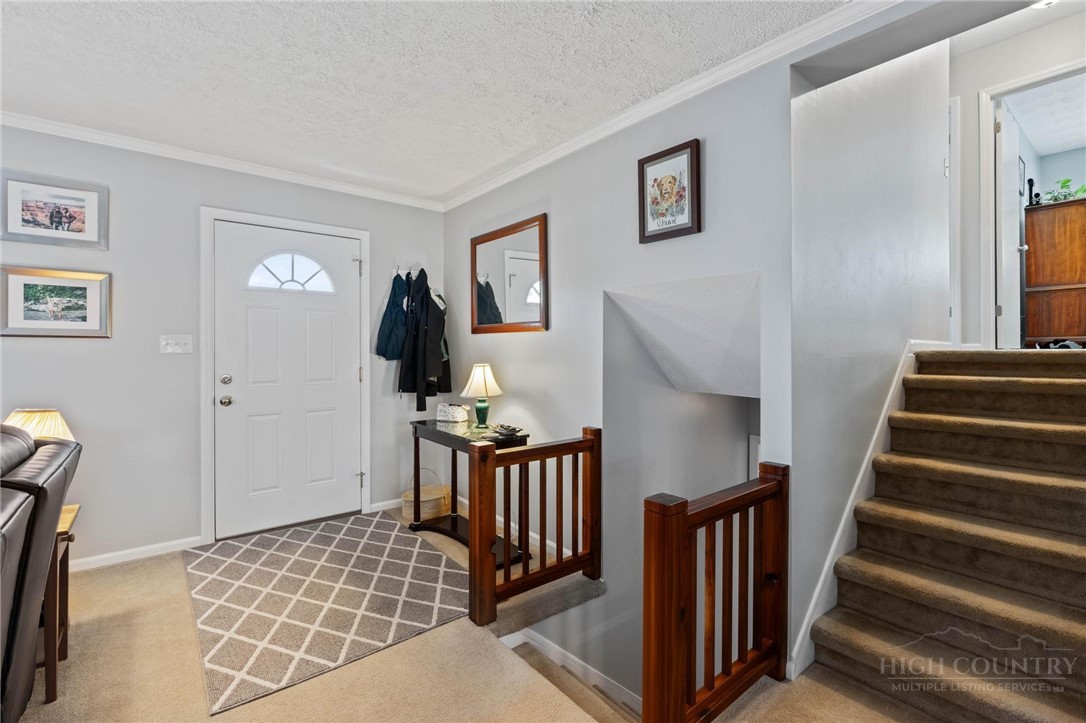 112 Chandy Street Boone, NC 28607 - Photo 7 of 50 a view of a hallway with windows and stairs
