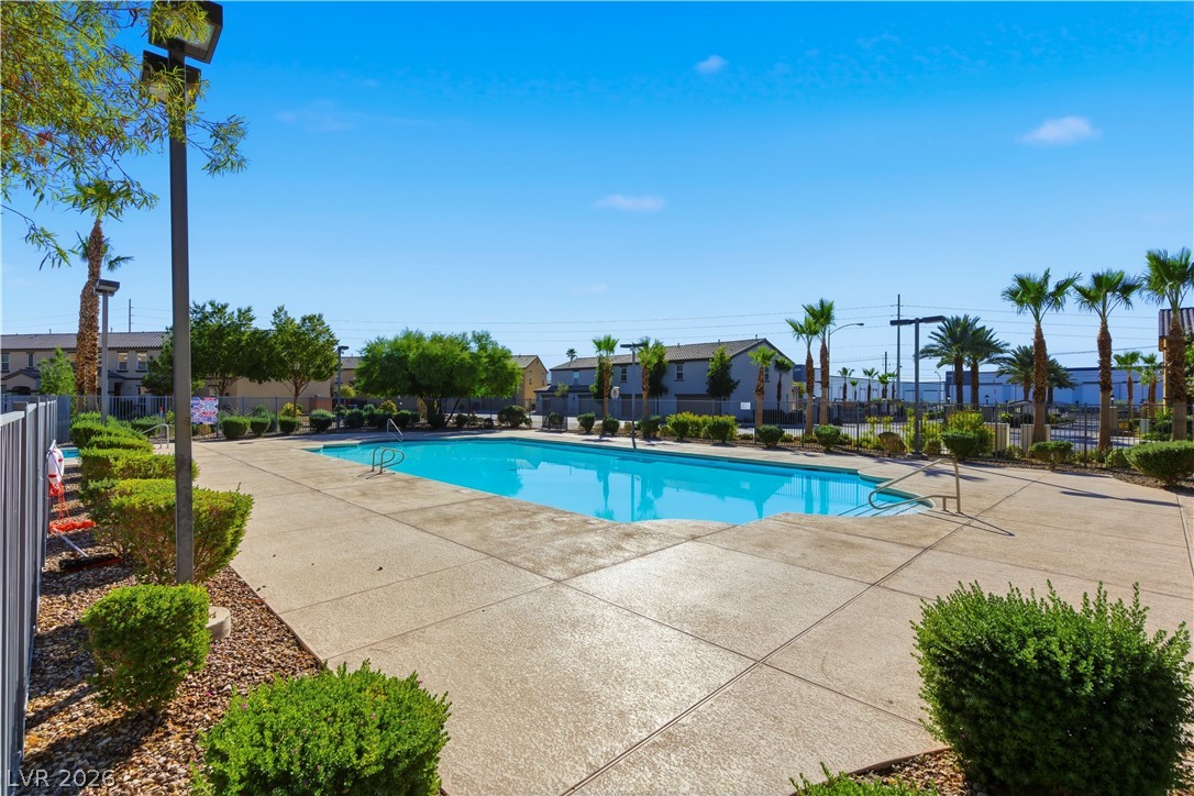 4536 Woolcomber Street Las Vegas, NV 89115 - Photo 30 of 34 Community pool with a patio