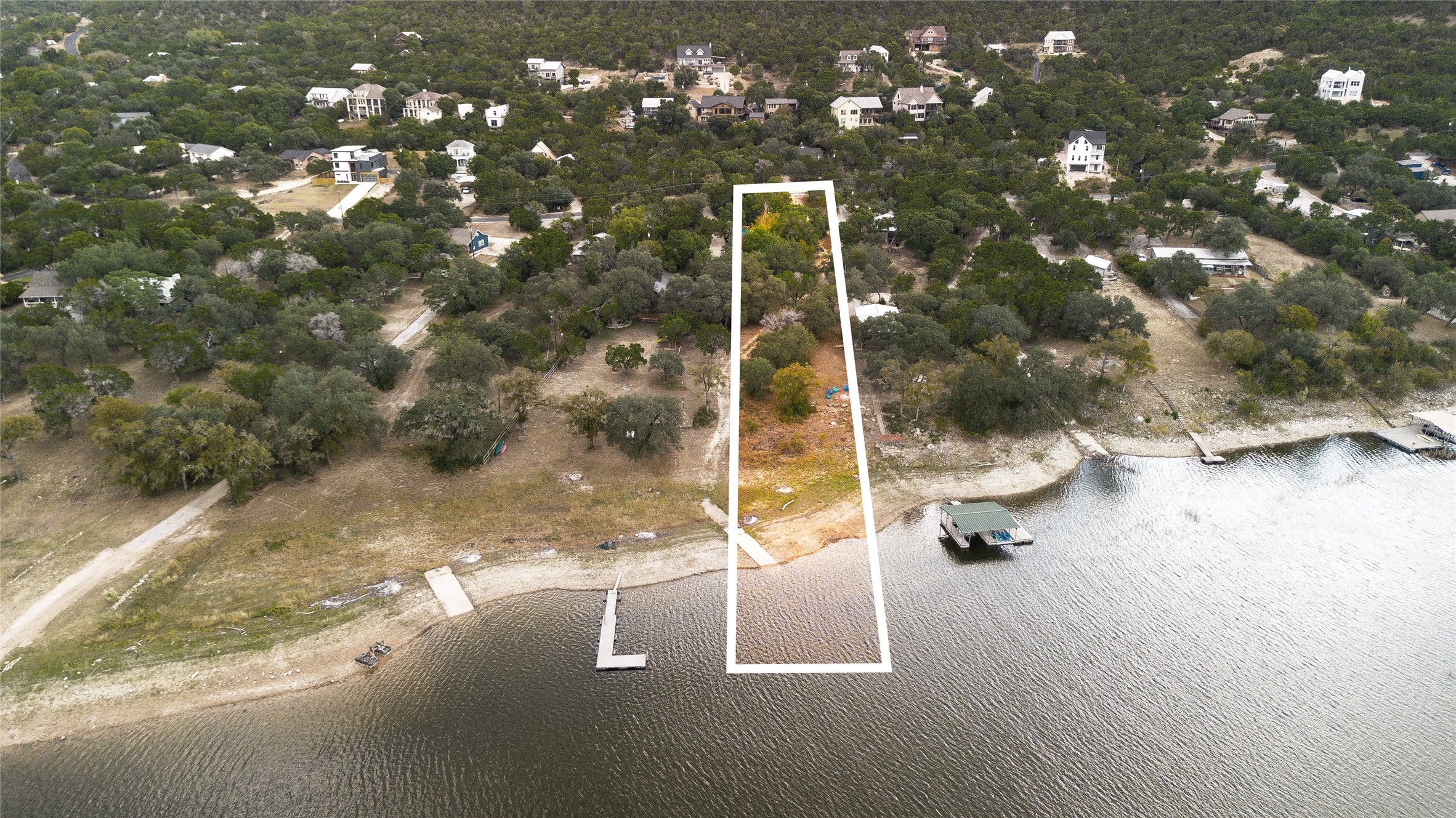 11104 Beach Road Leander, TX 78641 - Photo 3 of 21 Aerial view of property and surrounding area with a nearby body of water and property boundaries highlighted