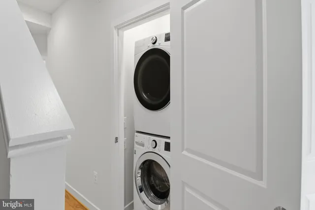 a view of a hallway with washer and dryer