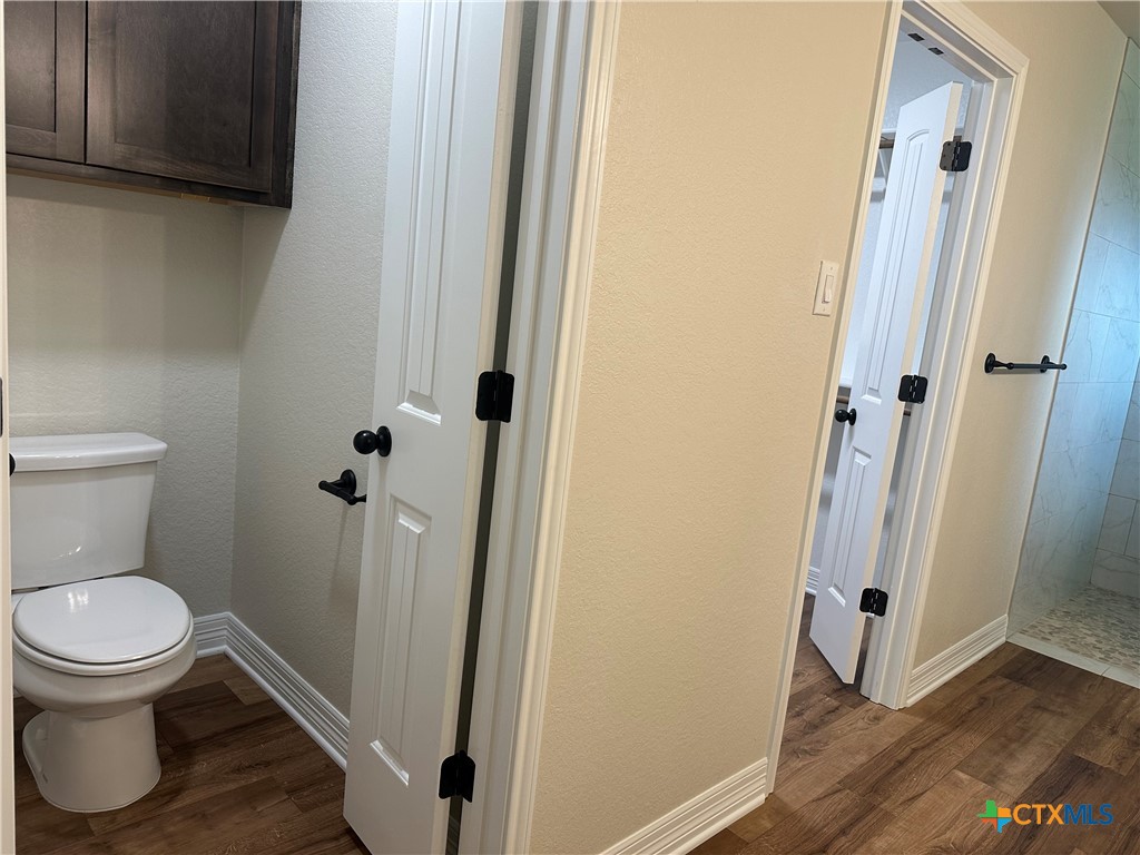 2003 Edna Lane Troy, TX 76579 - Photo 14 of 18 a white toilet sitting next to a sink