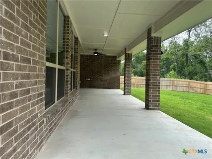 a view of a pathway both side of house