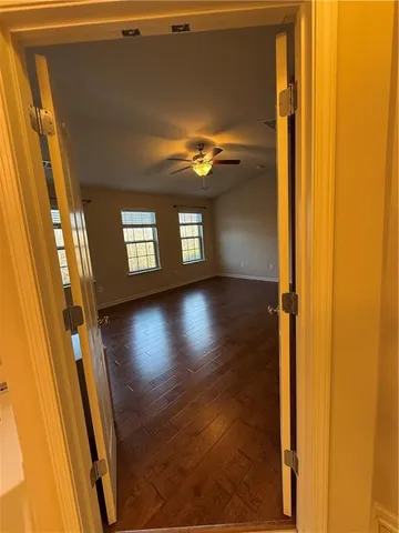 a view of entryway with a front door and wooden floor