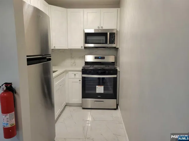 a kitchen with a stove and a microwave
