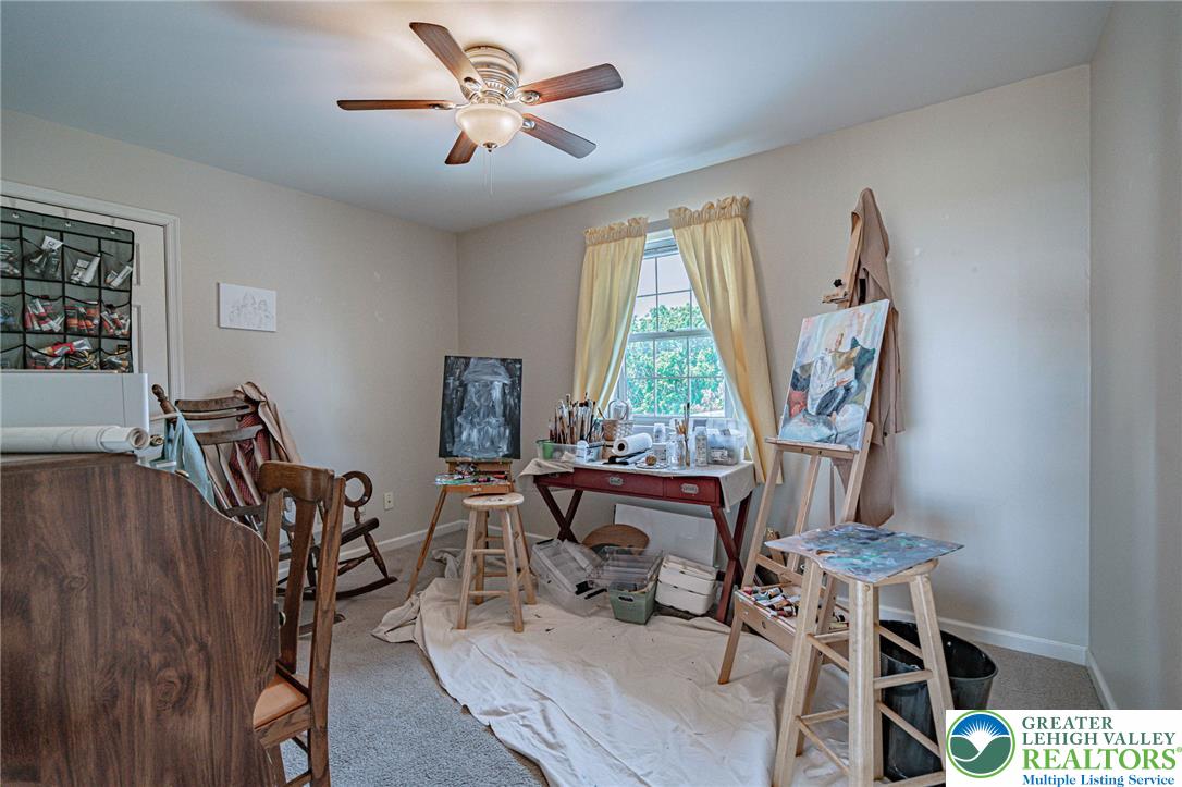 4542 Springfield Drive Coplay, PA 18037 - Photo 52 of 89 A quiet room with carpeted flooring and a window, ideal for a creative studio.