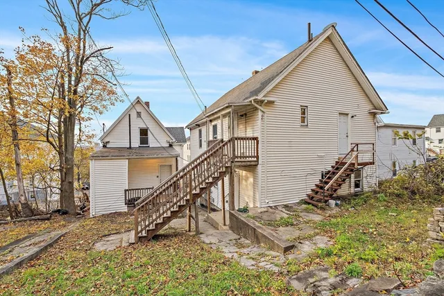 a bathroom with a toilet a sink and a mirror