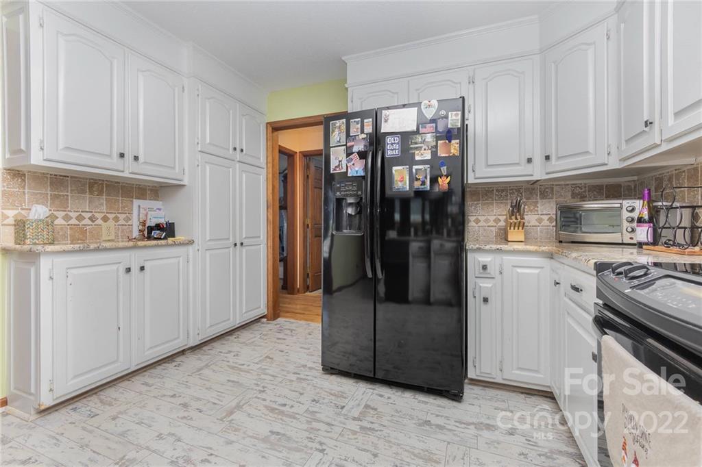 4414 Hunter Rhyne Road Lincolnton, NC 28092 - Photo 15 of 35 a kitchen with stainless steel appliances granite countertop a refrigerator and a stove