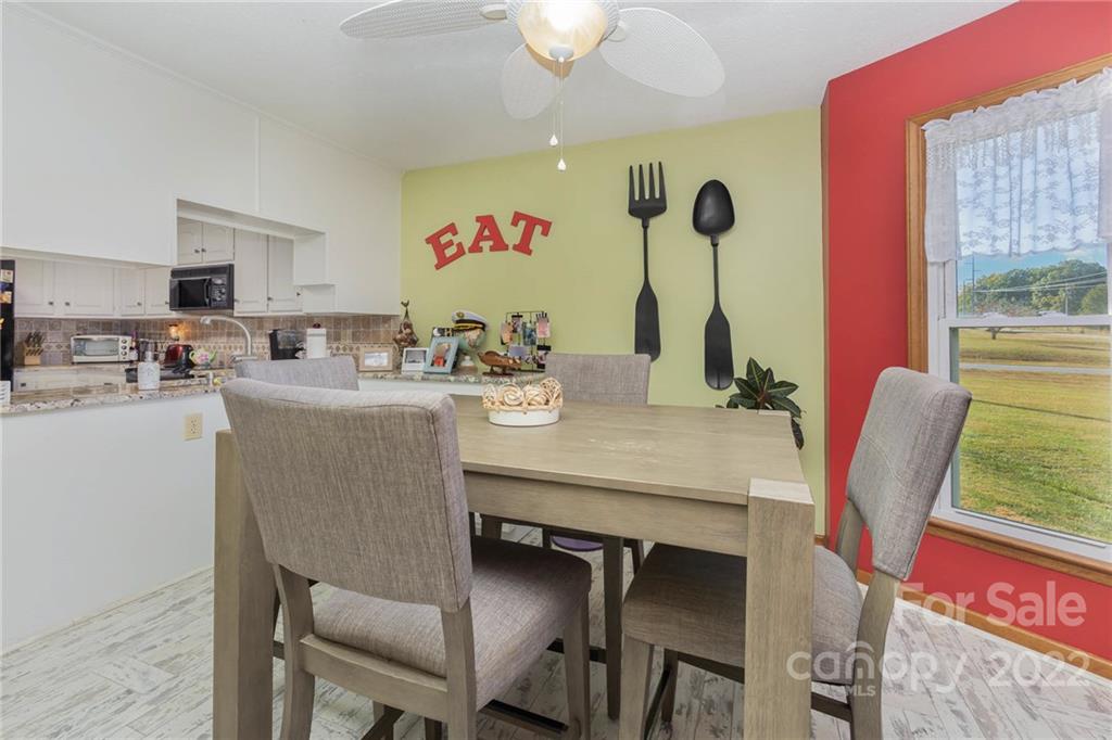 4414 Hunter Rhyne Road Lincolnton, NC 28092 - Photo 18 of 35 a dining room with furniture and window