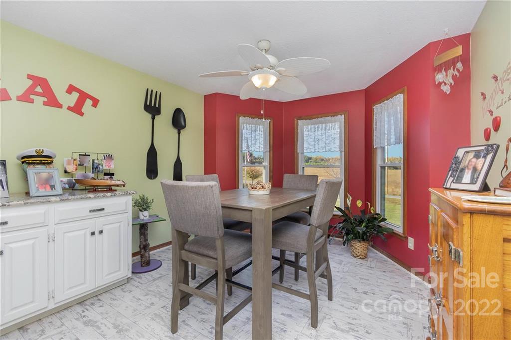 4414 Hunter Rhyne Road Lincolnton, NC 28092 - Photo 19 of 35 a view of a dining room with furniture window and wooden floor