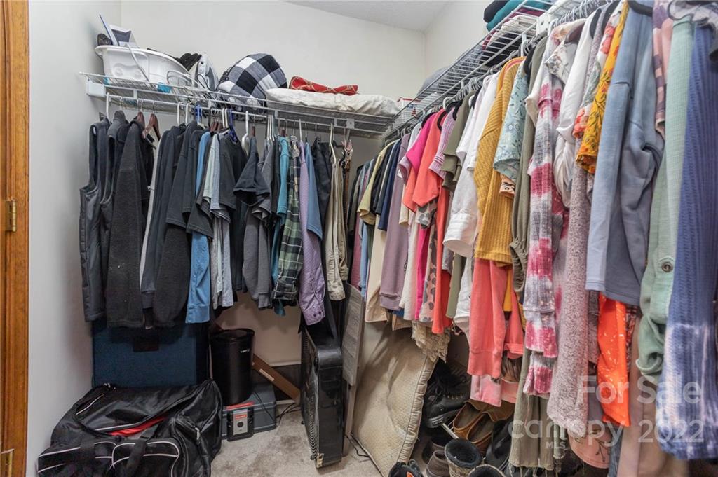 4414 Hunter Rhyne Road Lincolnton, NC 28092 - Photo 26 of 35 a view of walk in closet with clothes and shoes
