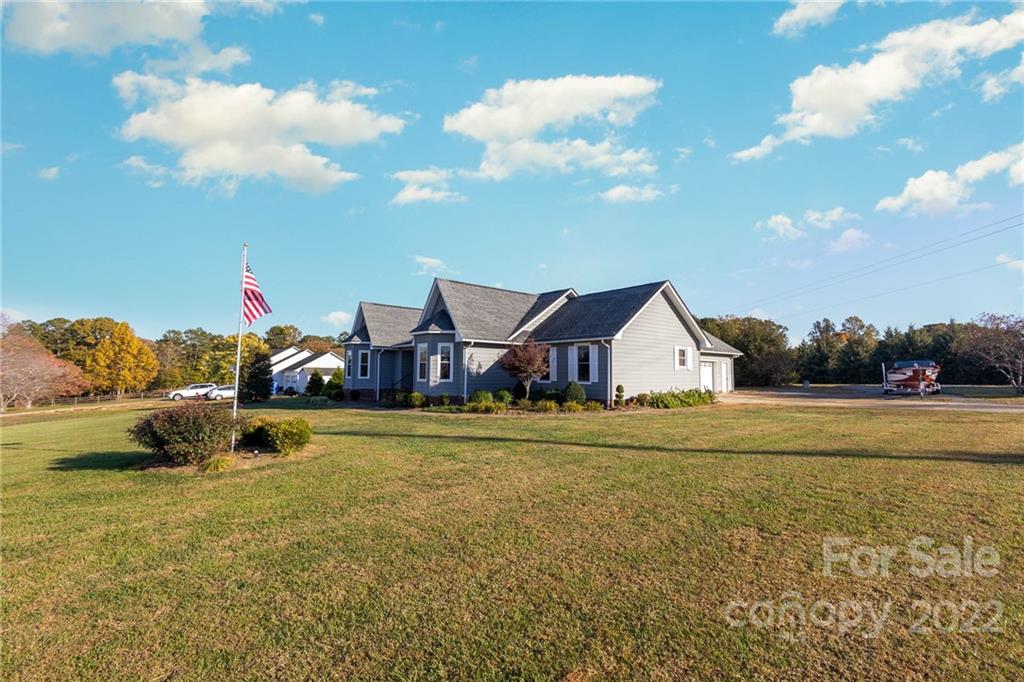 4414 Hunter Rhyne Road Lincolnton, NC 28092 - Photo 3 of 35 a front view of house with yard and trees