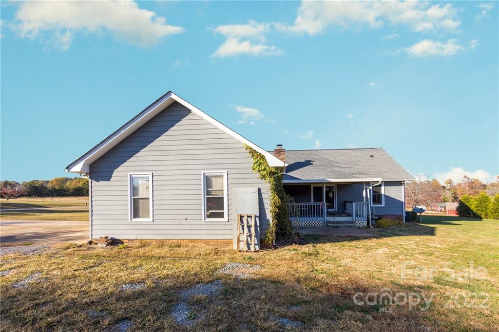 4414 Hunter Rhyne Road Lincolnton, NC 28092 - Photo 34 of 35 a view of a house with a yard