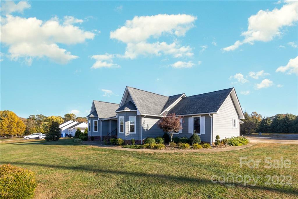 4414 Hunter Rhyne Road Lincolnton, NC 28092 - Photo 4 of 35 a front view of a house with a yard