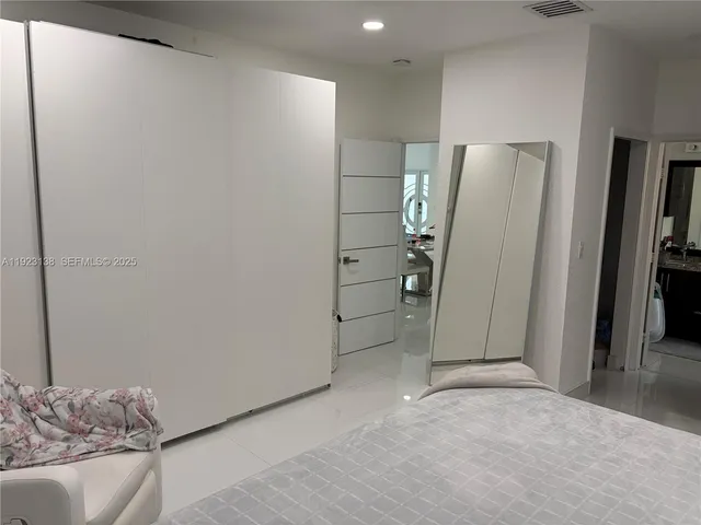 a view of livingroom with furniture and closet area