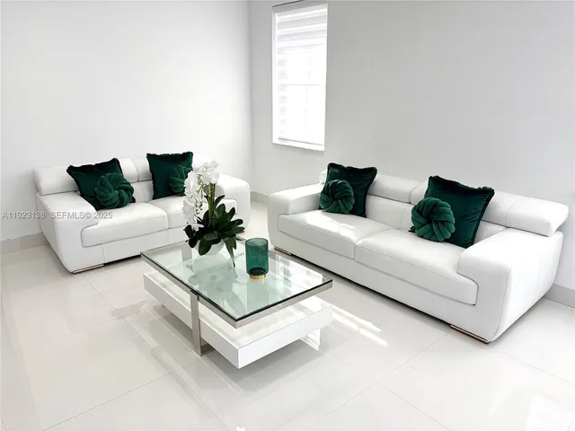 a living room with furniture and a couch