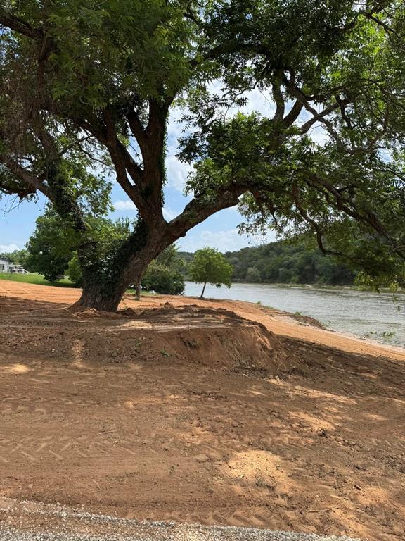 Lot 133 River Shoals Weatherford, TX 76088 - Photo 15 of 20 a view of a yard with an trees