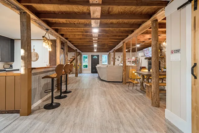a kitchen with stainless steel appliances wooden cabinets and a stove top oven