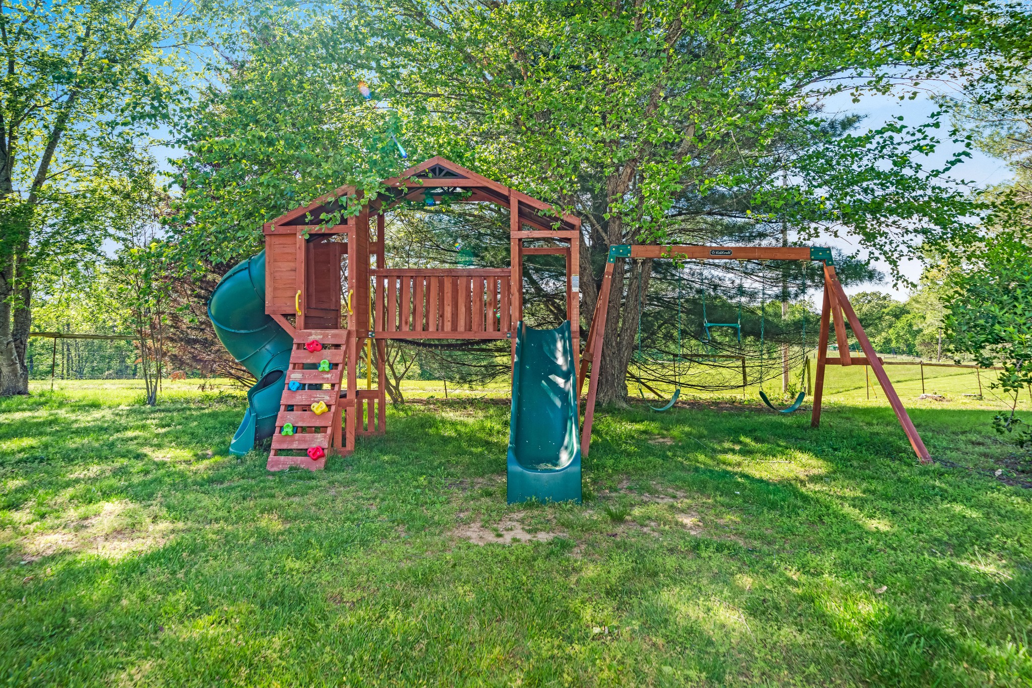 1323 Mt Zion Road Ashland City, TN 37015 - Photo 38 of 81 a view of a backyard with a slide trees and wooden fence
